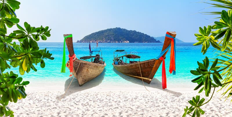 Beautiful beach with thai traditional wooden longtail boat and blue sky in Similan islands, Thailand