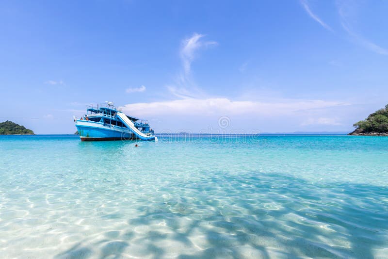 Beautiful beach view Koh Chang island and Tour boat for tourists seascape at Trad province Eastern of Thailand on blue sky backgro