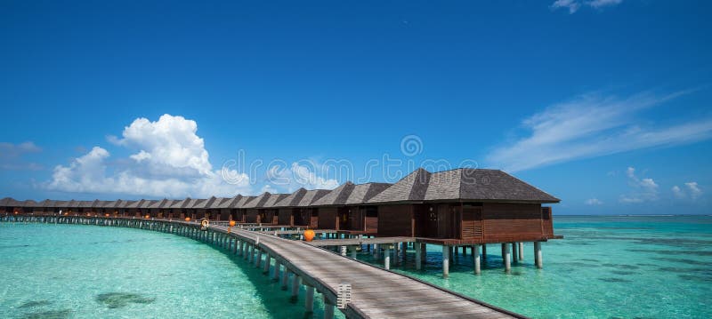 Beautiful beach with water bungalows at Maldives, panorama format royalty free stock images Beautiful beach with water bungalows at Maldives, panorama format royalty free stock images