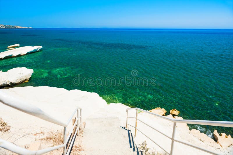 Beautiful beach with white cliff and blue sea royalty free stock photography Beautiful beach with white cliff and blue sea royalty free stock photography