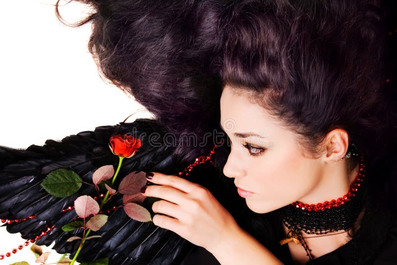 Beautiful black angel with a scarlet rose