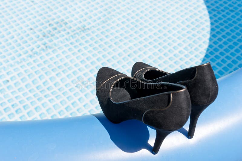 Black High Heels on the Edge of the Swimming Pool Stock Photo - Image ...