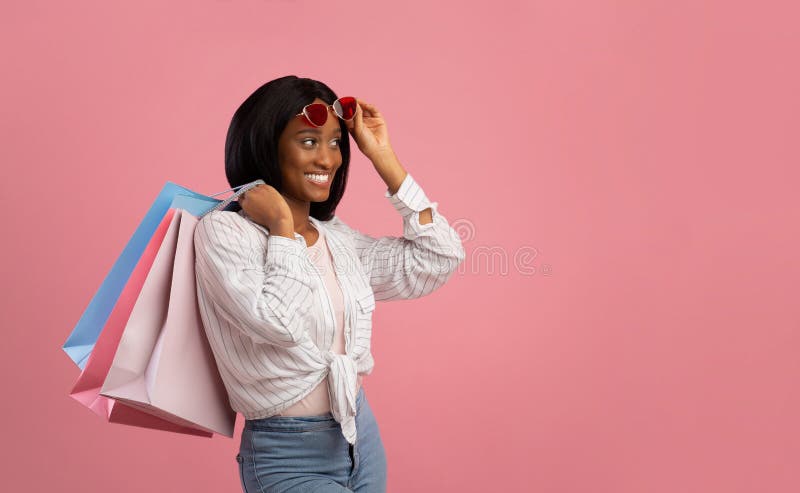 Beautiful Black Woman with Shopping Bags Looking at Empty Space for ...