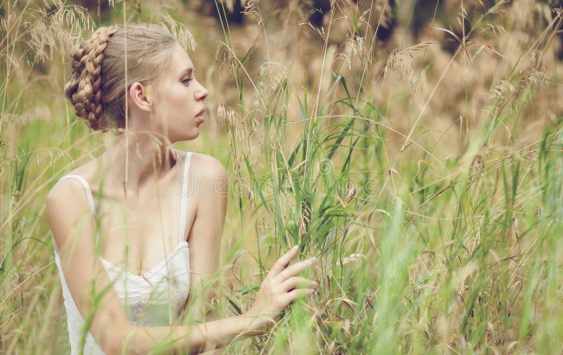 Beautiful blond girl in the field