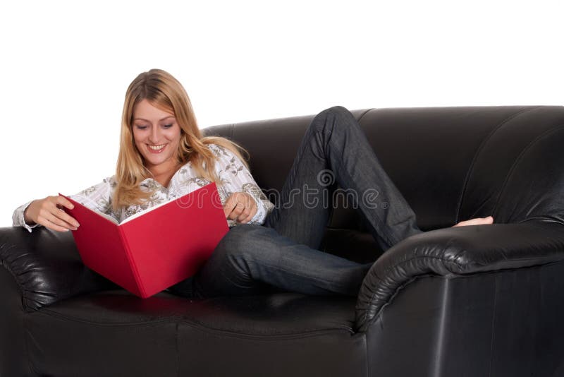 Beautiful blond girl is reading her book