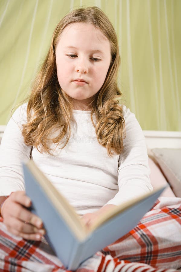 Beautiful Blond Girl Sick in Bed Reading a Book Stock Image Image of