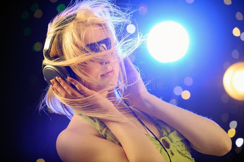 Beautiful blond with headphones stock image