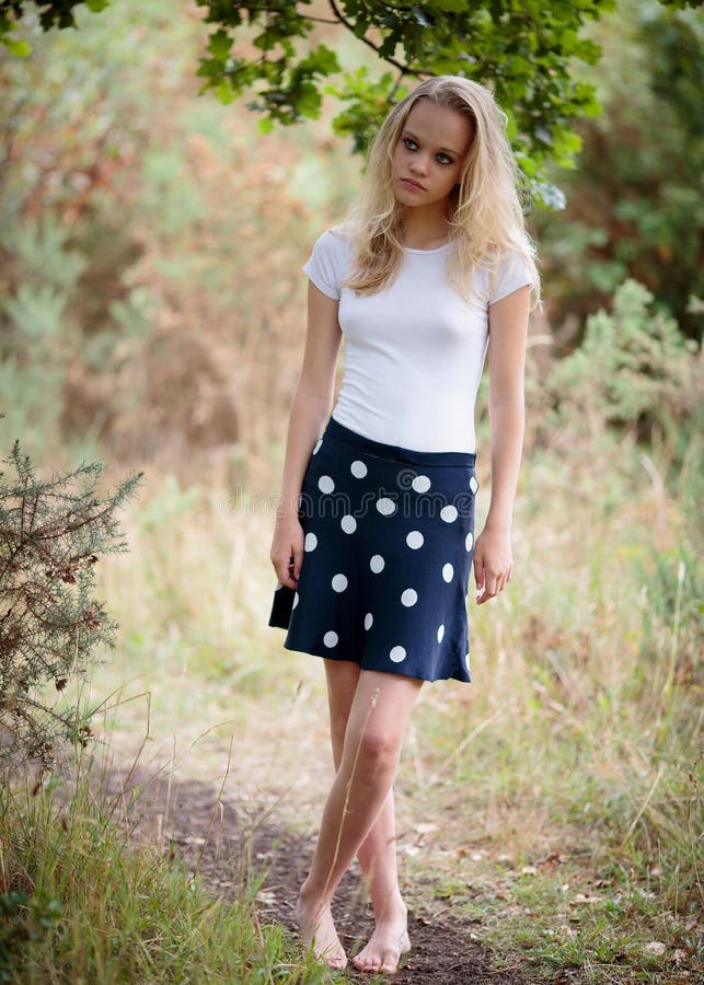 Beautiful Serious Blond Teenage Girl In White Top Stock Photo Image