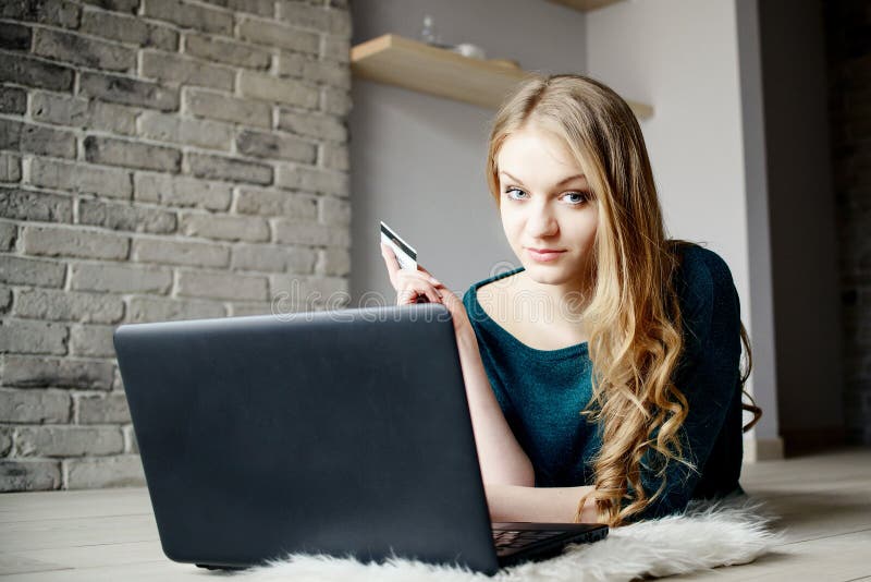 Beautiful blond woman doing shopping on the internet. stock image Beautiful blond woman doing shopping on the internet. stock image