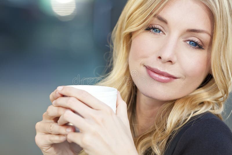 Beautiful Blond Woman Drinking Coffee royalty free stock photo Beautiful Blond Woman Drinking Coffee royalty free stock photo