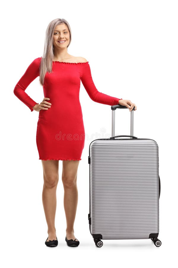 Beautiful blond woman in a red dress with a suitcase