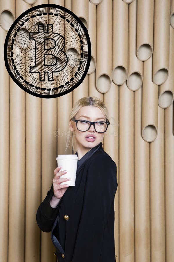 Beautiful blond woman showing standing near bitcoin sketch. Virtual money or btc crush concept. Cryptocurrency. royalty free stock photography Beautiful blond woman showing standing near bitcoin sketch. Virtual money or btc crush concept. Cryptocurrency. royalty free stock photography