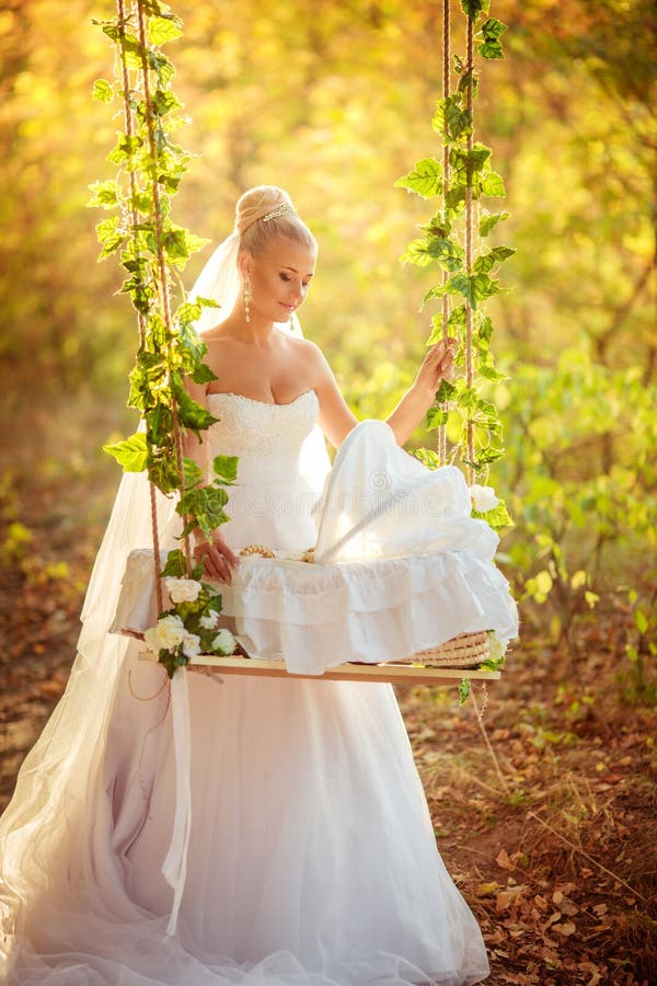 Beautiful blonde bride in white dress
