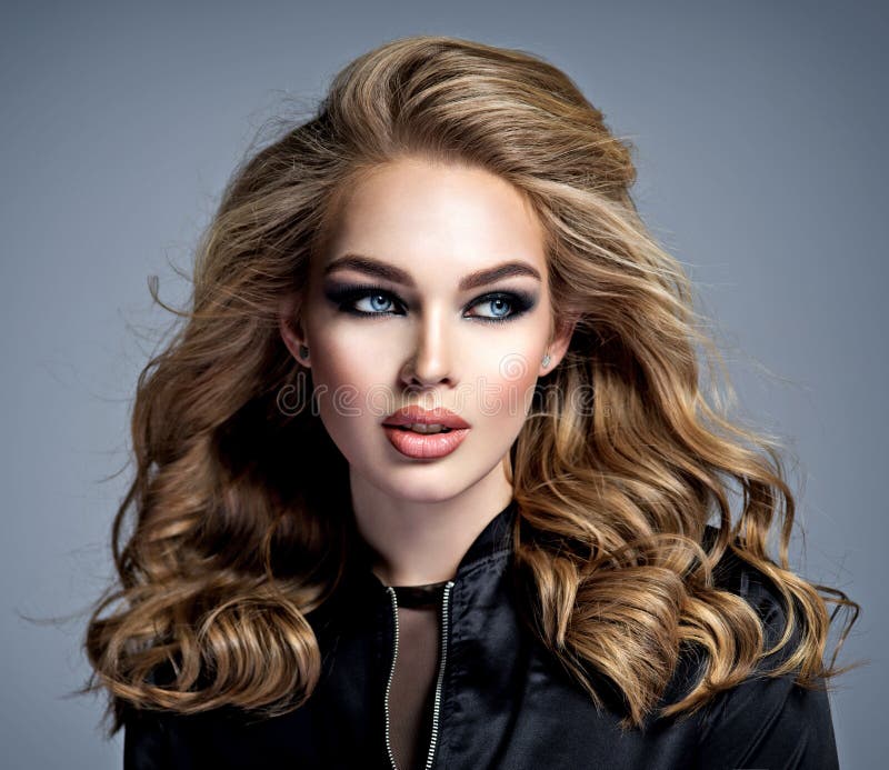 Beautiful blonde girl with makeup in style smoky eyes stock photography Beautiful blonde girl with makeup in style smoky eyes stock photography