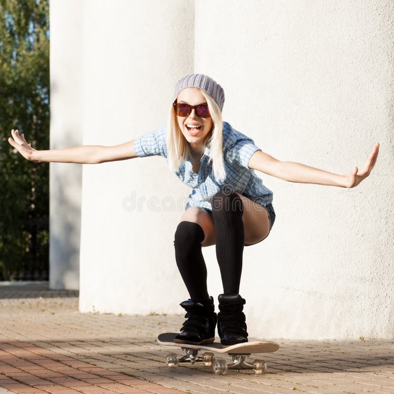 Back View Of Beautiful Young Girl With Short Shorts And Skateboard Outdoors  On A Hot Summer Day. Warm Tones Edition. Stock Photo, Picture and Royalty  Free Image. Image 36301346.
