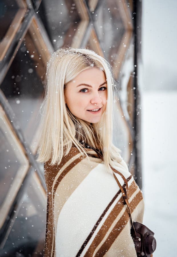 Beautiful Blonde Girl with a Vintage Camera Smiling Against the ...