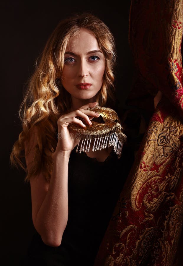 Young Beautiful Blonde with a Gold Venetian Mask Stock Image - Image of ...