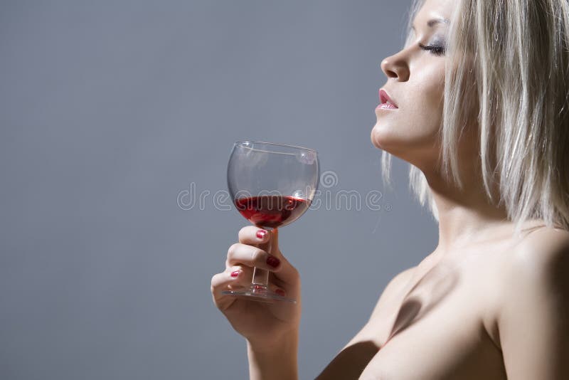 Beautiful blonde holding a glass of red wine