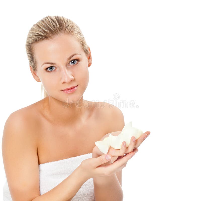 Beautiful blonde portrait holding rose petals