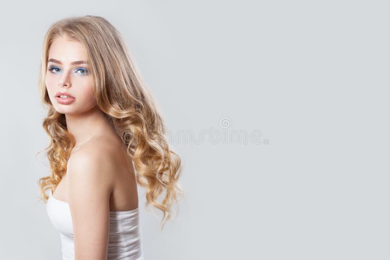 Beautiful blonde posing on white background