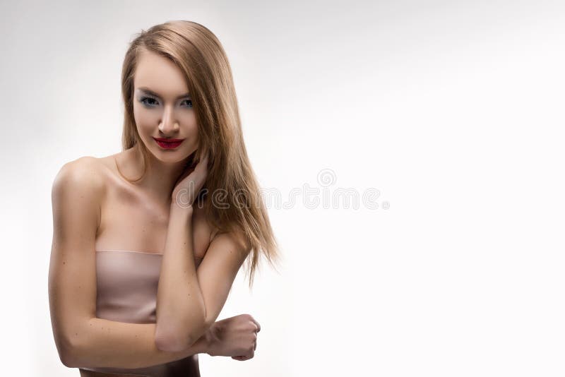 The beautiful blonde red lips smiling girl touches by fingers fa royalty free stock images The beautiful blonde red lips smiling girl touches by fingers fa royalty free stock images