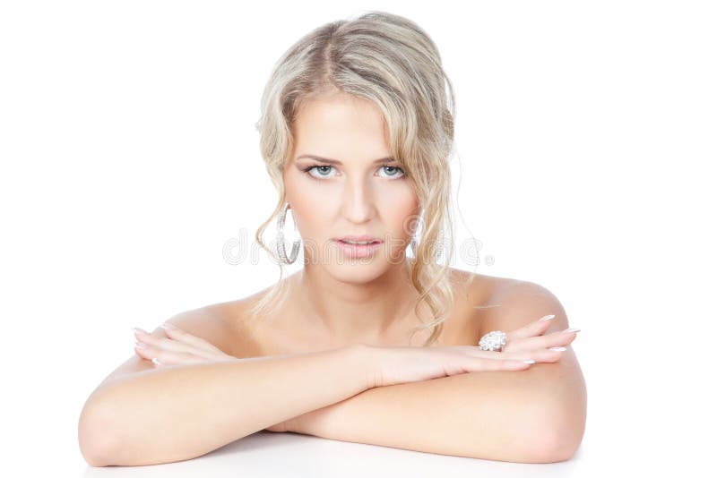 Beautiful blonde woman with jewelry over white