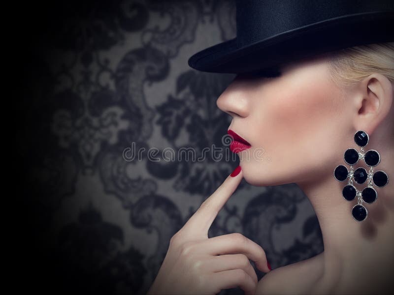 Beautiful blonde woman with red lips and manicure