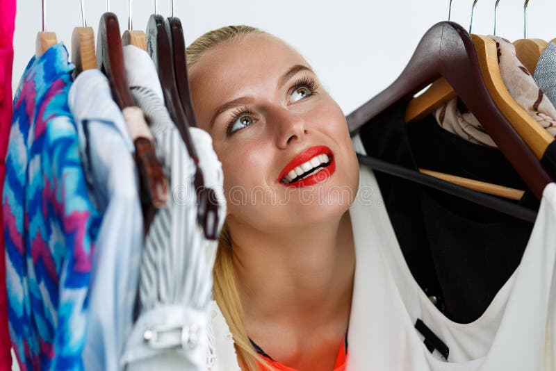 Beautiful Blonde Woman Standing Inside Wardrobe Rack Stock Image Image Of Expression Decide
