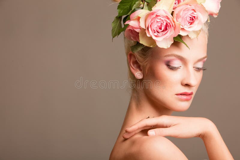 Beautiful blonde with a wreath of flowers