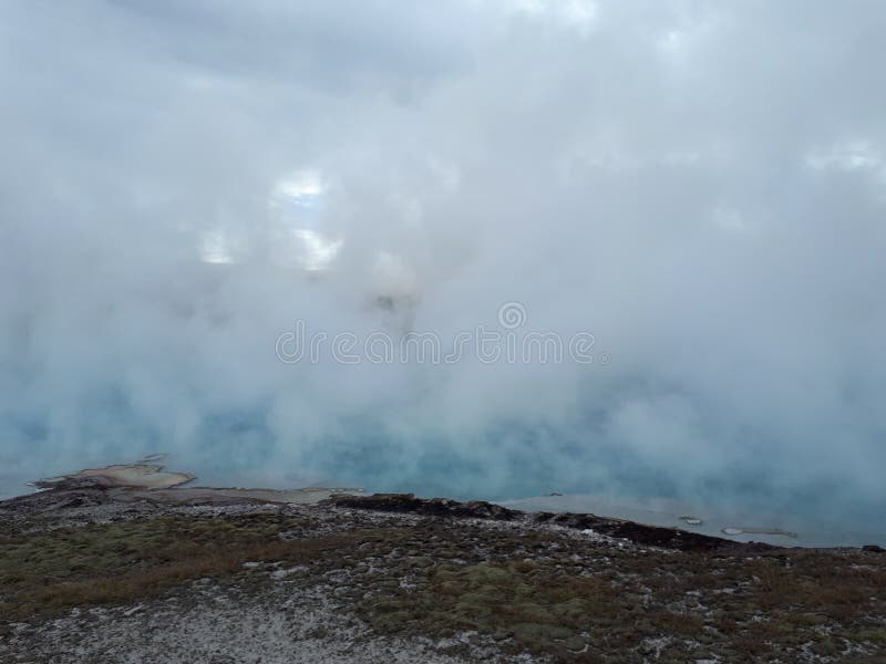 Beautiful Blue Geyser `Mystic spring` in Norris Geyser Basin in Park Yellowstone royalty free stock image Beautiful Blue Geyser `Mystic spring` in Norris Geyser Basin in Park Yellowstone royalty free stock image