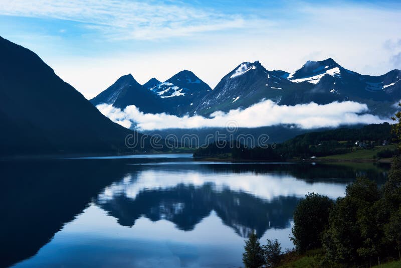Beautiful Blue Landscape with Snowcapped Mountains and Thier