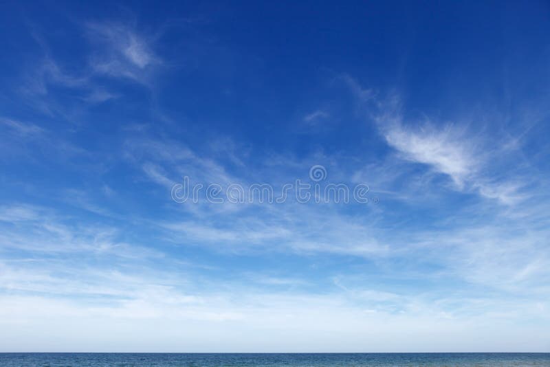 Beautiful blue sky with cirrus clouds over the sea. Skyline.