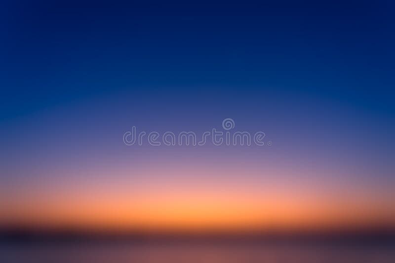 Beautiful blurred sky before sunrise with natural gradient of orange and blue sky background stock photos