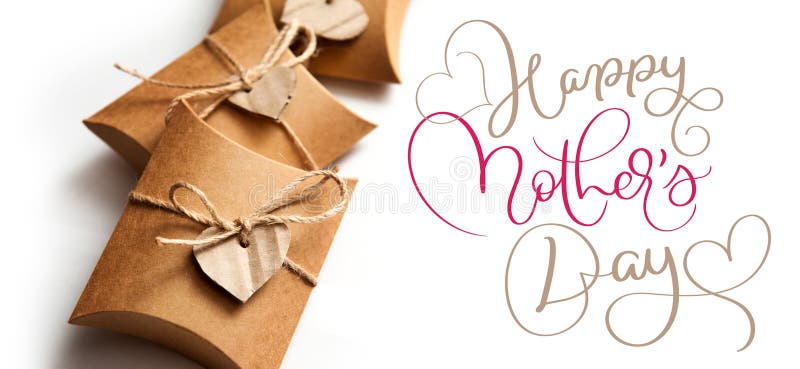Beautiful boxes for gifts on a white background and text Happy mothers day. Calligraphy lettering hand draw stock photos Beautiful boxes for gifts on a white background and text Happy mothers day. Calligraphy lettering hand draw stock photos