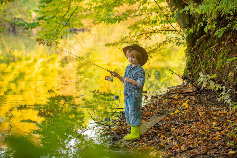 Beautiful Boy Fishing in the Forest. Forest Lake and Fishing. Stock