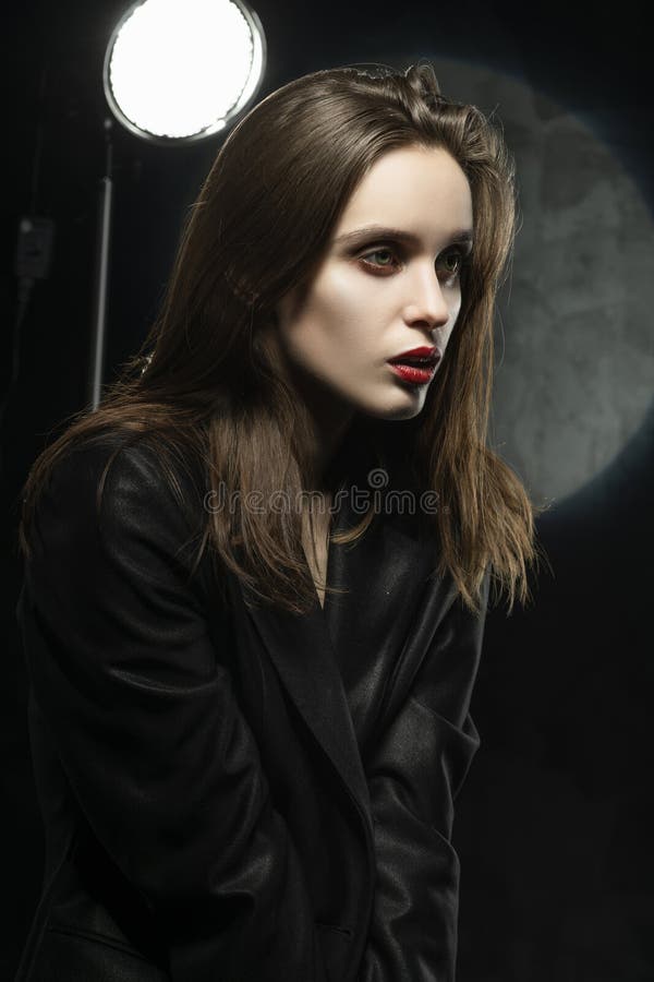 Beautiful Braless Girl With Red Lips Wearing An Unbuttoned Black