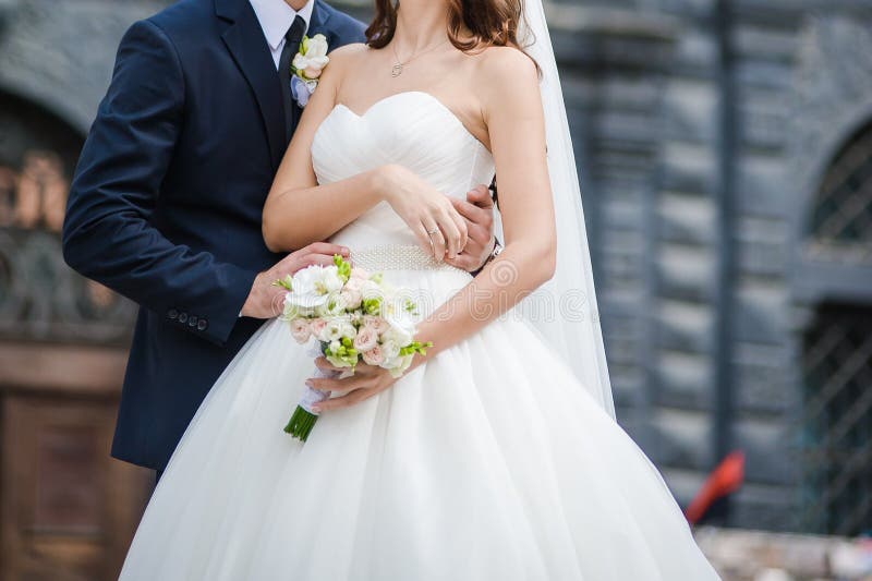 Beautiful bride with big wedding bouquet