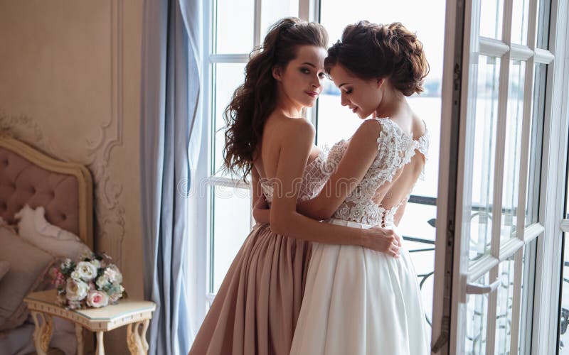 Beautiful bride and bridesmaids in luxury dresses.