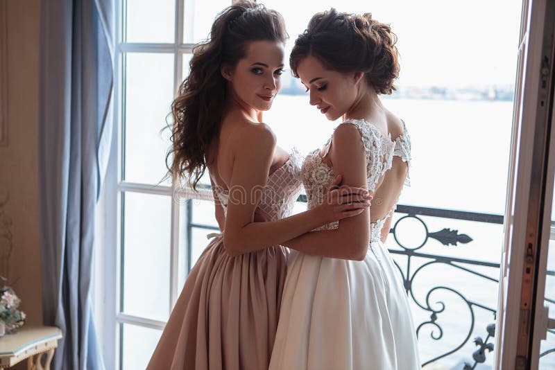 Beautiful bride and bridesmaids in luxury dresses.