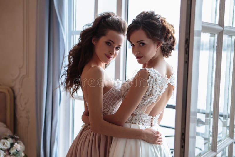 Beautiful bride and bridesmaids in luxury dresses.