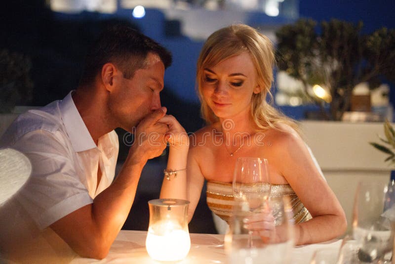 Beautiful bride and groom in their summer wedding day on greek island Santorini