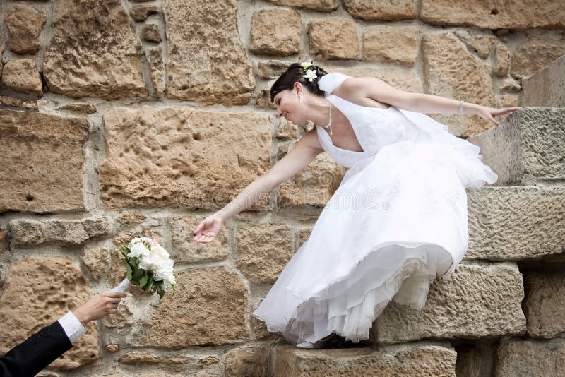 Beautiful bride reaching for