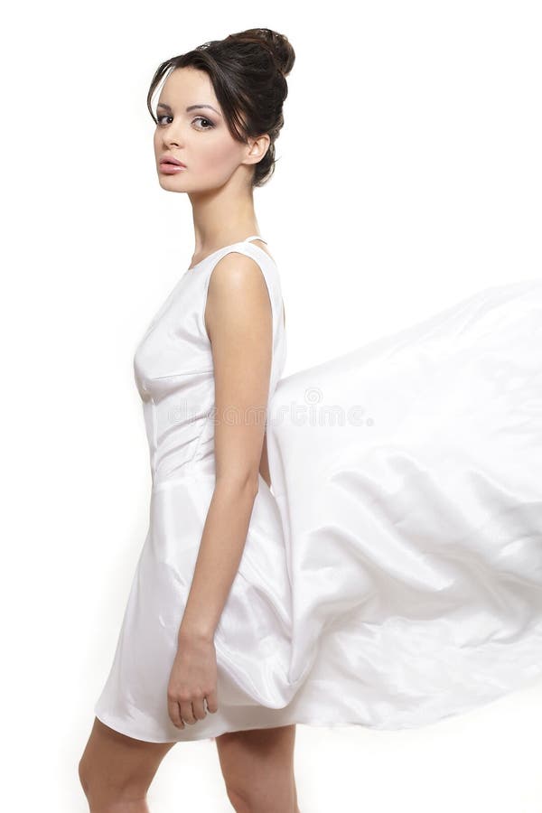 Beautiful bride woman wearing white flying dress