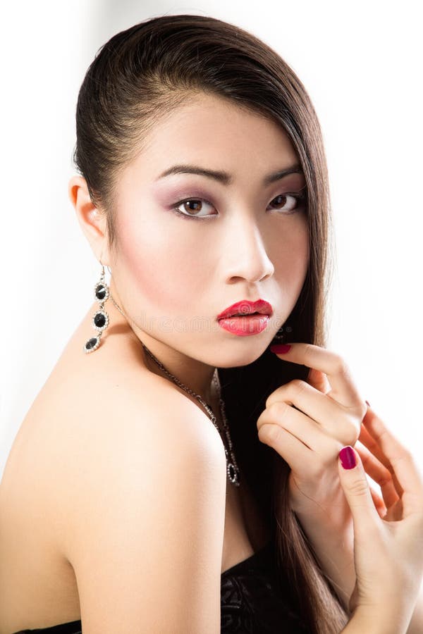 Beautiful brunette Asian woman with long black hair stock photo Beautiful brunette Asian woman with long black hair stock photo