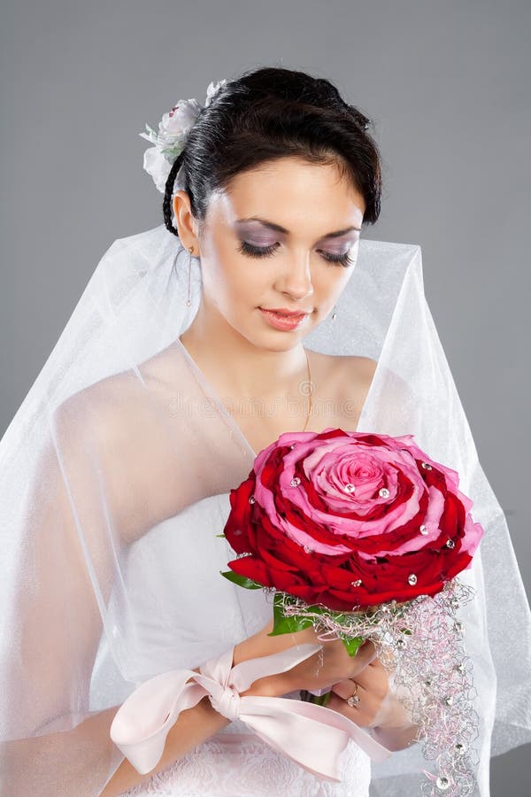 Beautiful brunette bride with a bouquet