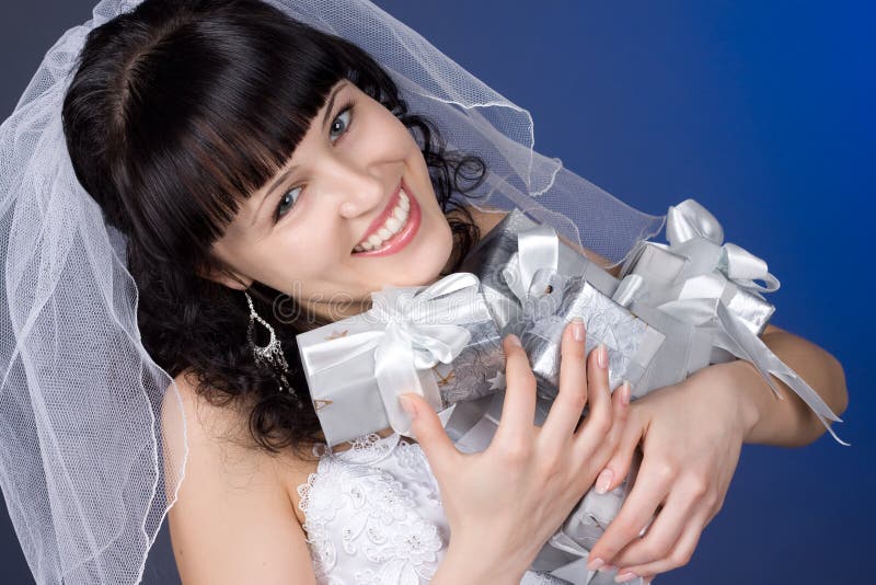 Beautiful brunette bride with presents stock photo