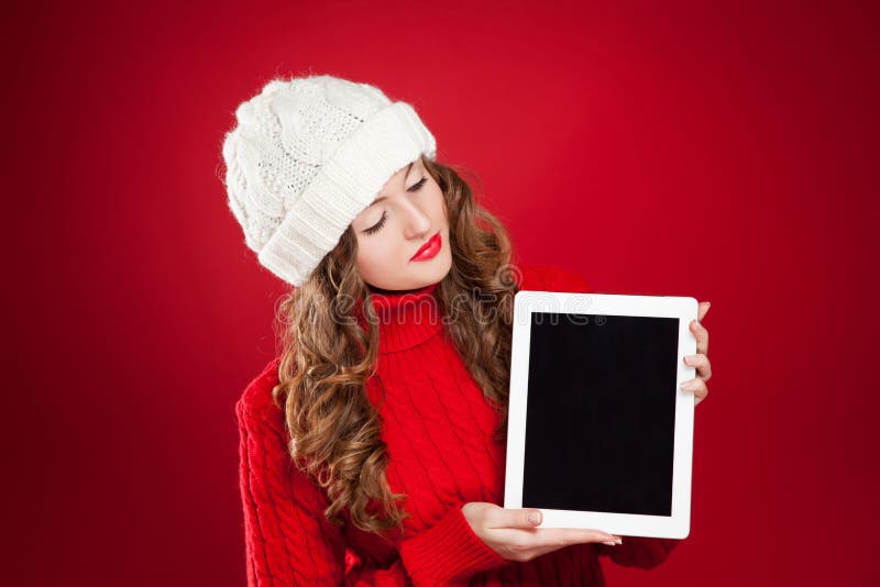 Beautiful brunette girl holding ipad