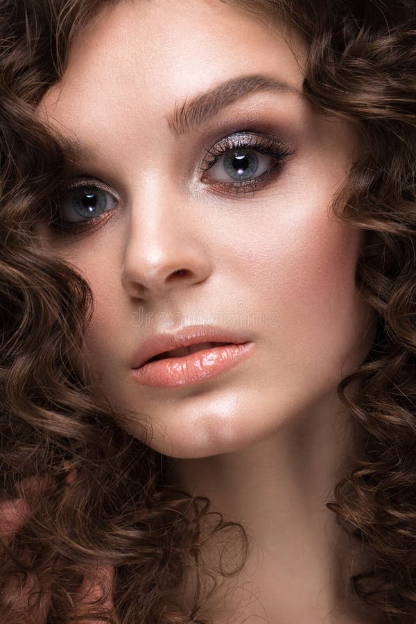 Beautiful Brunette Girl With A Perfectly Curly Hair With Curling And Classic Make Up Beauty 