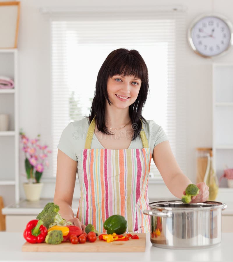 https://thumbs.dreamstime.com/b/beautiful-brunette-woman-cooking-vegetables-20099561.jpg