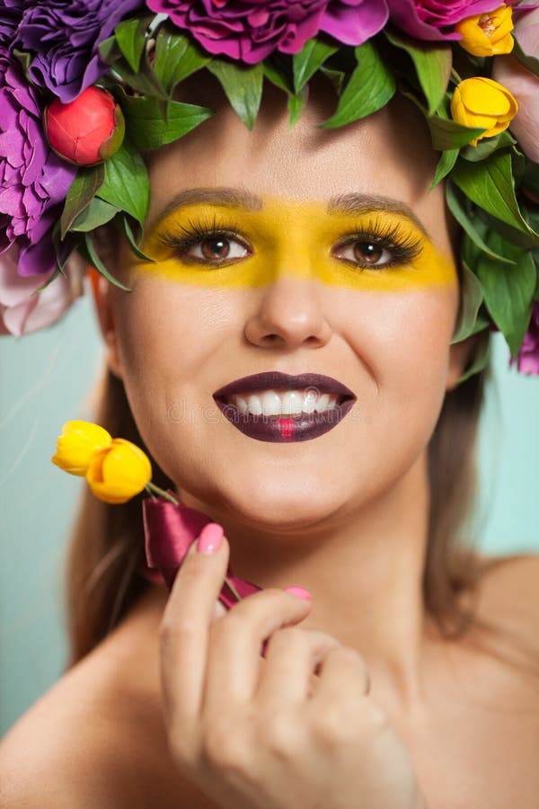 Beautiful Brunette Woman With Flower Wreath On Her Head. Stock Image
